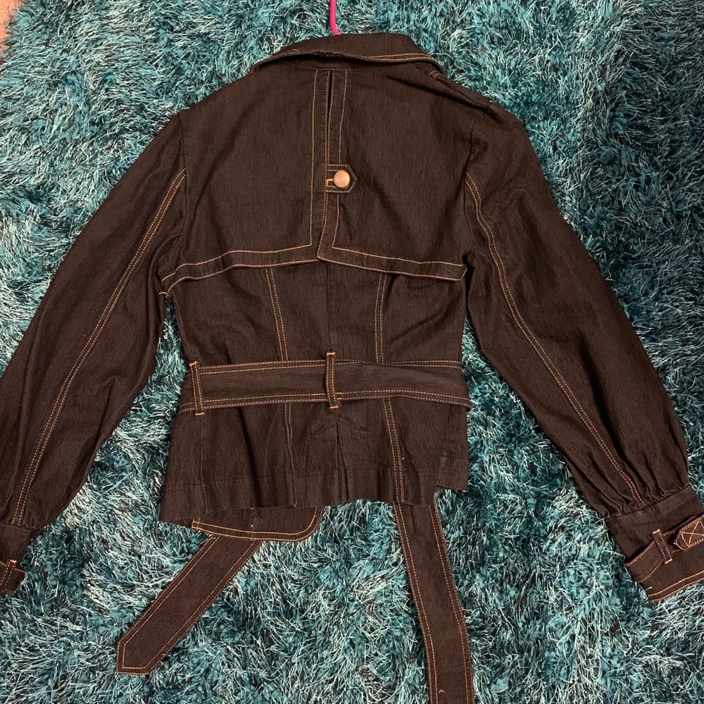 This jacket is so nice. It’s denim and a little below the waist.
